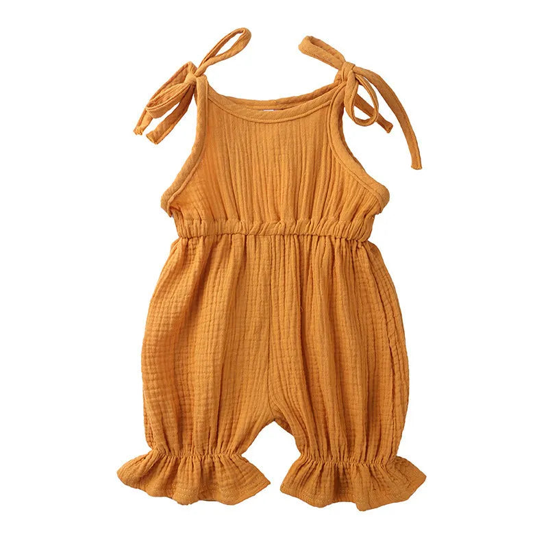 Baby girls sleeveless solid cotton romper jumpsuit in pink, front view