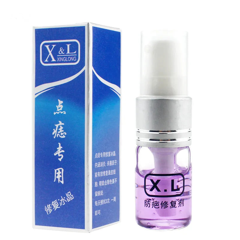 Blue light acne beauty instrument removal pen set with cooling gel and needles on a table