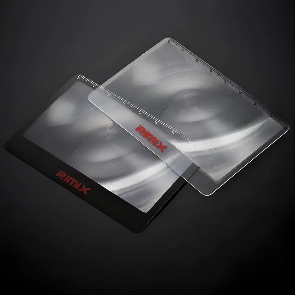 Black and white credit card-sized plastic magnifier for portable reading assistance