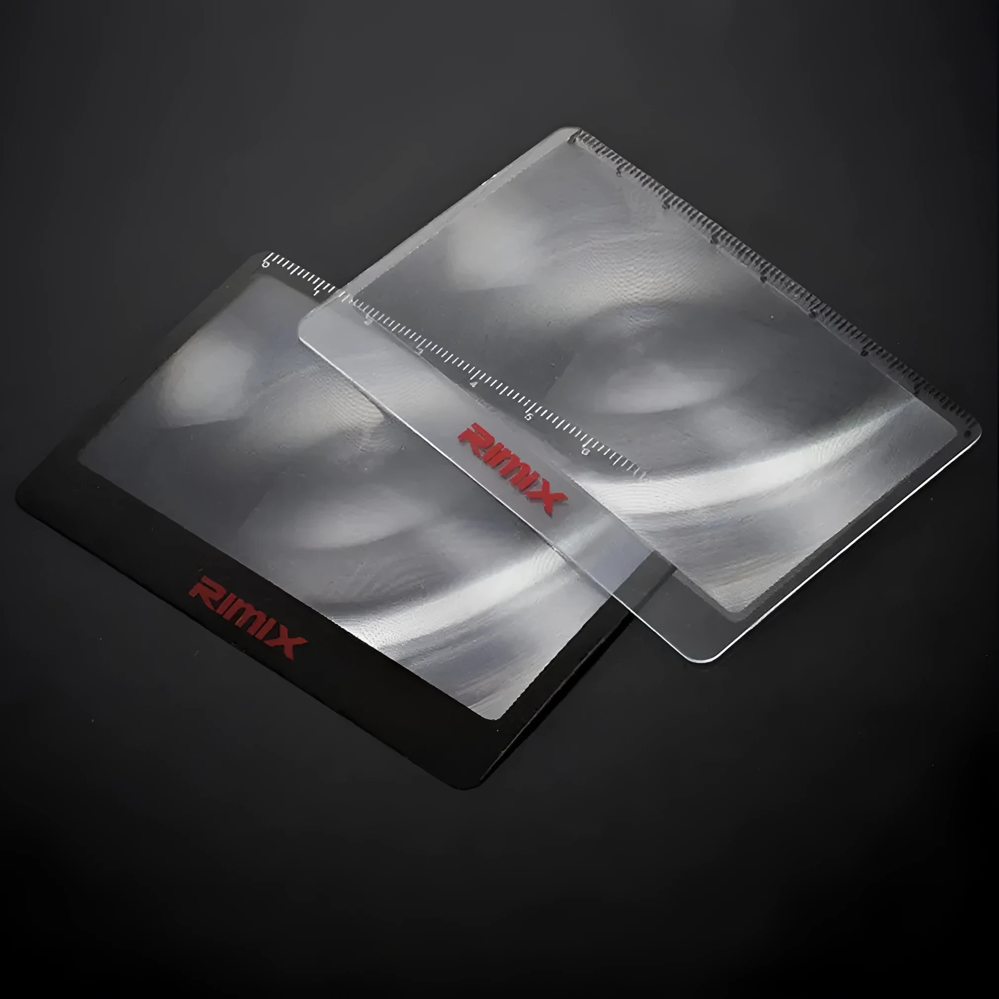 Black and white credit card-sized plastic magnifier for portable reading assistance