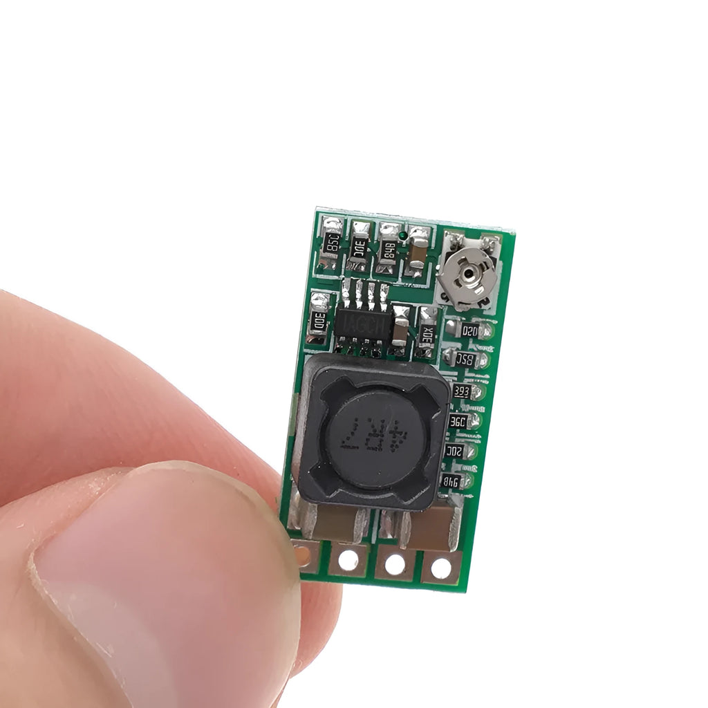 Green mini DC-DC step down power module converting 12-24V to 5V 3A output.