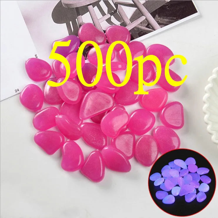 Luminous fluorescent aquarium and garden pebbles in mixed colours including dark purple, yellow, light blue, pink, orange