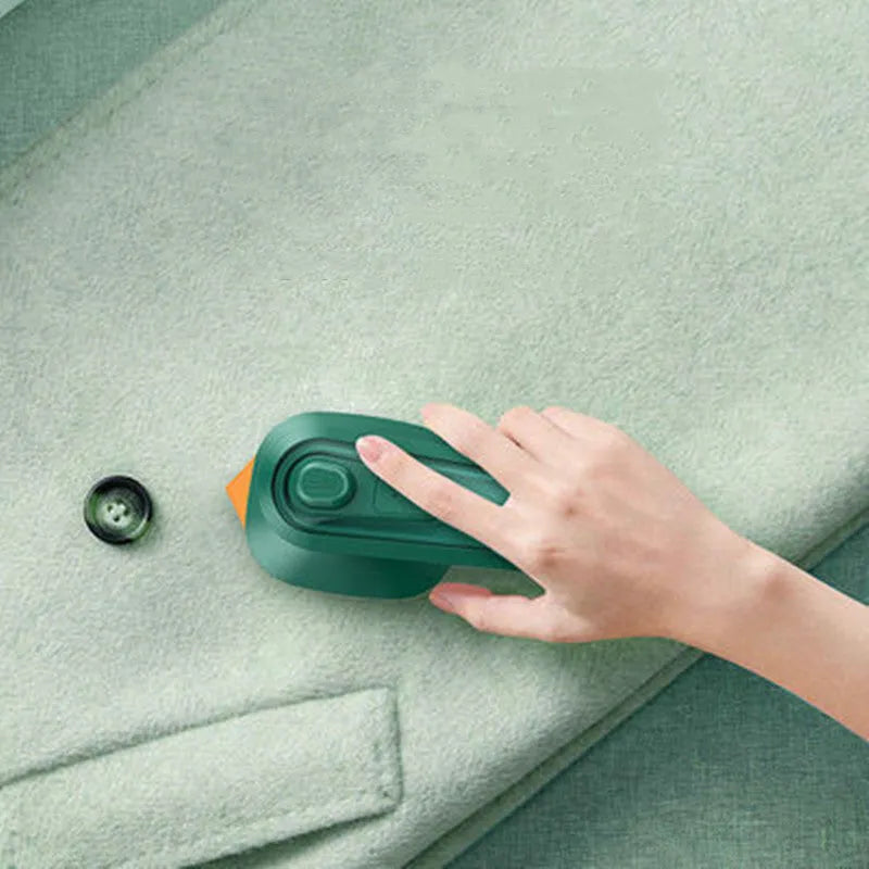 Dark green portable hanging steam ironing machine with ceramic panel.