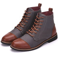 Men's black leather motorcycle boots with buckle details and a thick rubber sole.