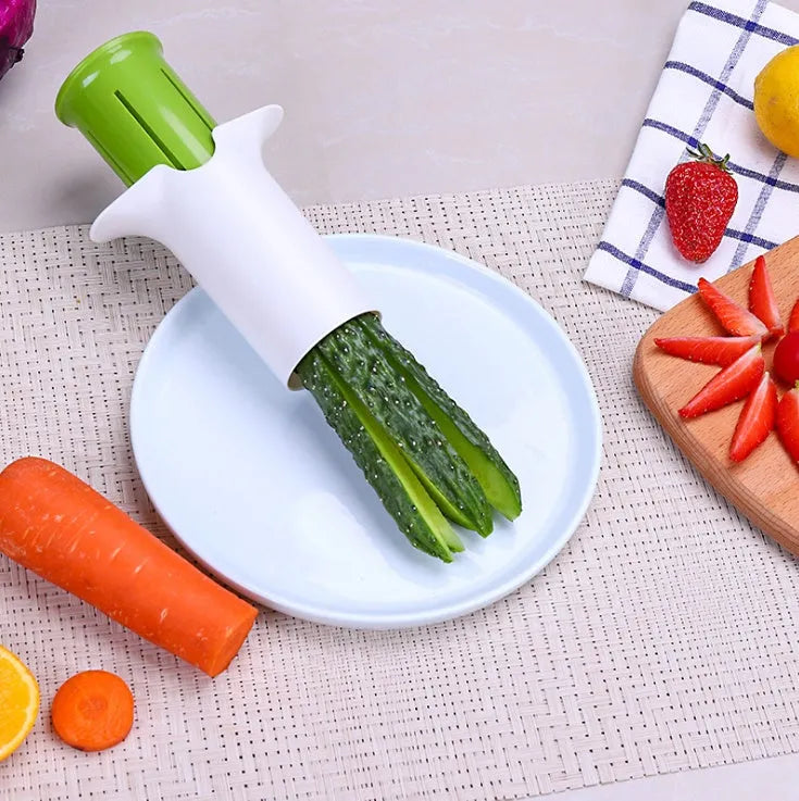 White vegetable cutter with six stainless steel blades for slicing cucumbers, carrots and strawberries