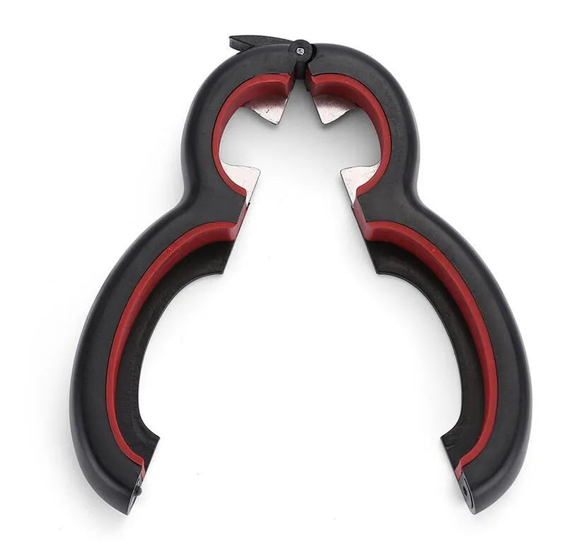 Six-in-one can opener in grey, ergonomic handle with stainless steel parts, on a kitchen counter
