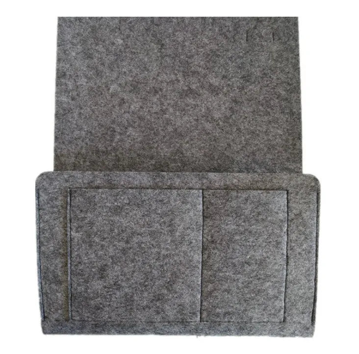Felt bed storage bag with pocket in beige on a bed, small size 28x24cm, anti-slip organiser for mattress or sofa