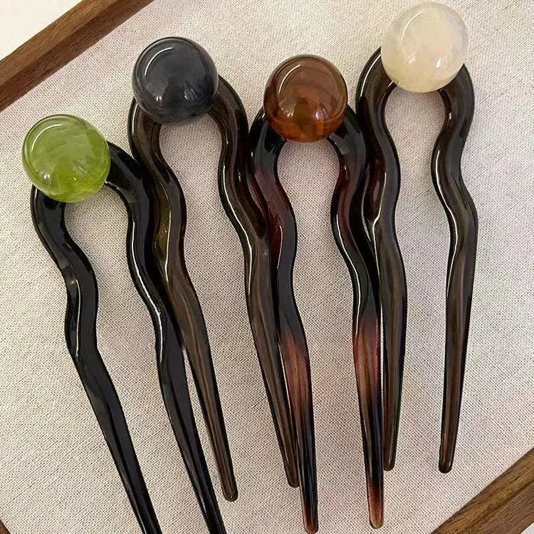 Simple U-shaped acrylic barrettes with ball retro design in beige, caramel, dark gray and green colours