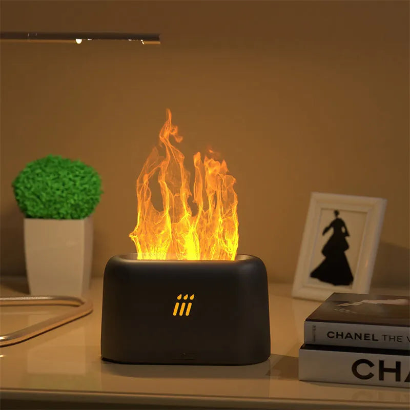 Black round flame aroma diffuser humidifier with LED lighting on wooden surface