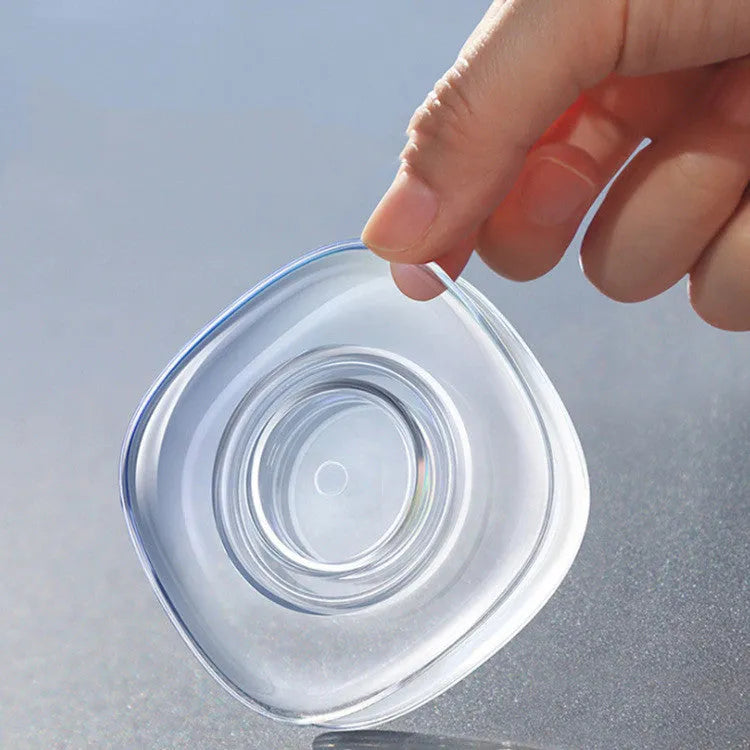 Transparent circular and square silicone nano gel adhesive pads on a smooth surface