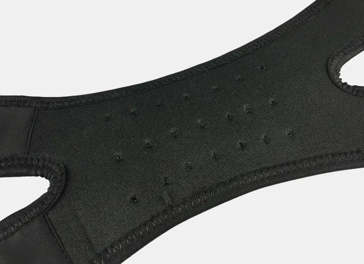 Professional patella band knee support in black with shock absorbing EVA pad and breathable rear perforations