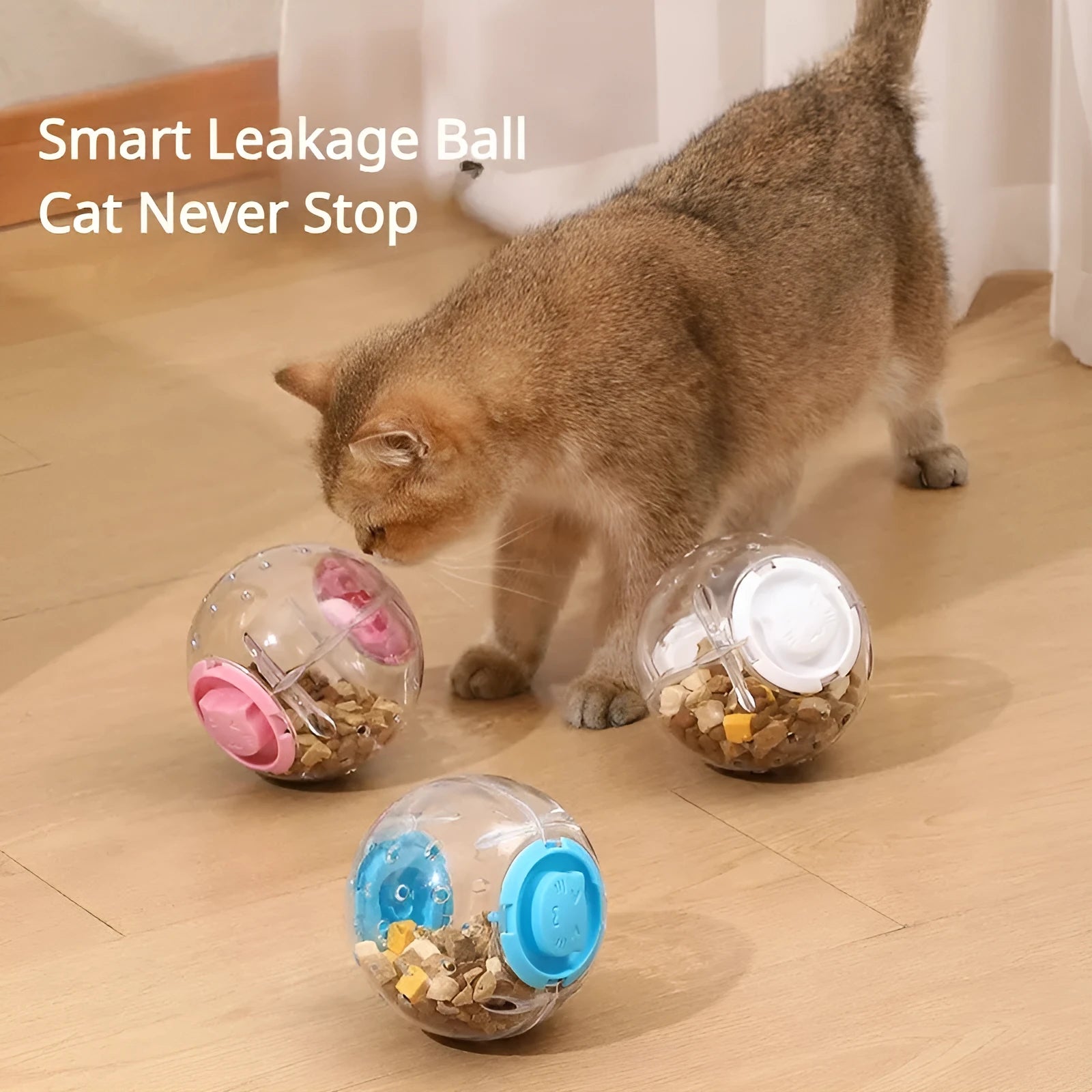 Clear blue ABS plastic slow feeder ball for cats, 11.5cm in diameter, on a wooden floor.