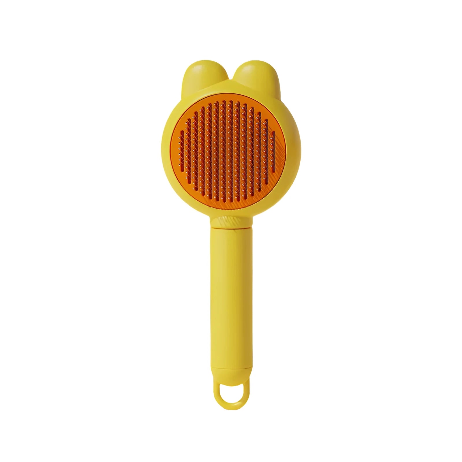 Green self-cleaning pet brush with a metal comb, release button, and comfort-grip handle for grooming cats and dogs.