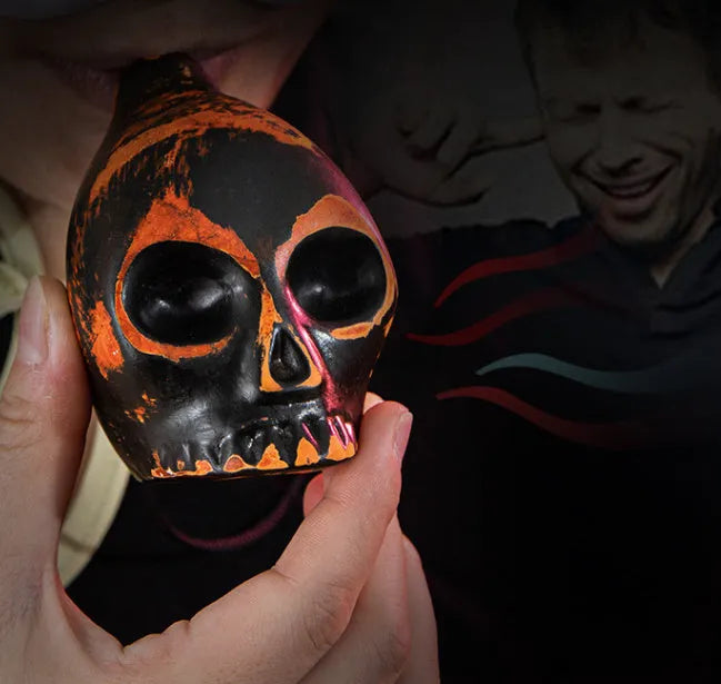 Skull whistle decompression toy made from dolomite ceramic in matte black finish