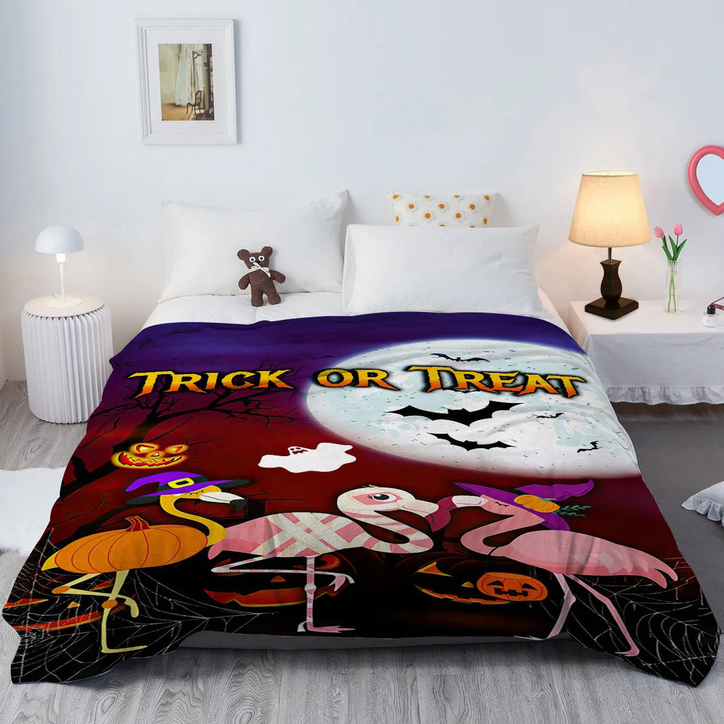Purple flannel Halloween flamingo printed blanket on a sofa, size 130x150cm