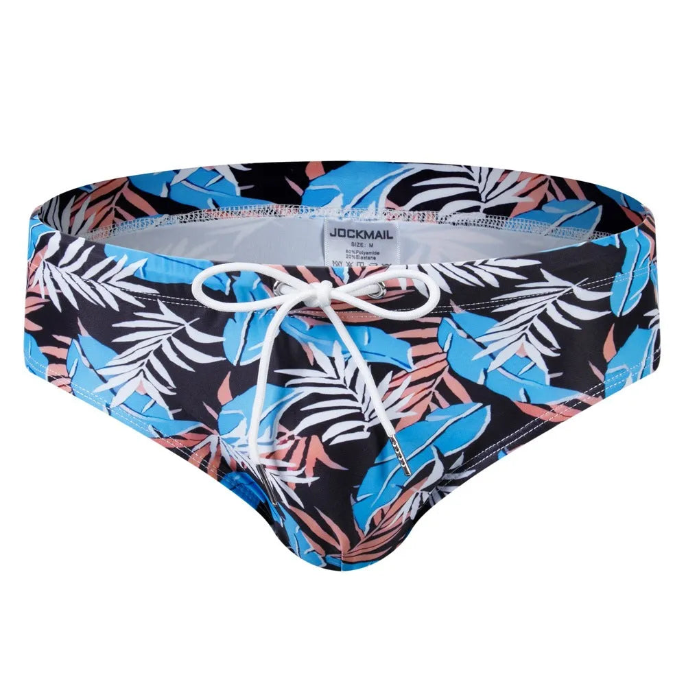 Men's low waist triangle nylon swimming trunks in solid colour with pattern, front view
