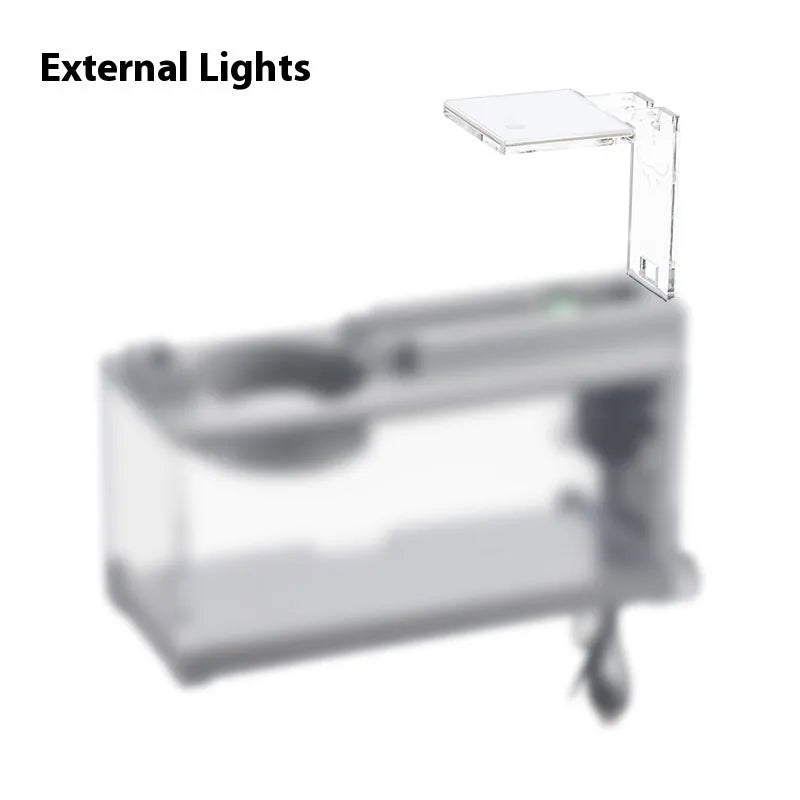 Small stone trough plastic fish tank with water pump and built-in light on a desk