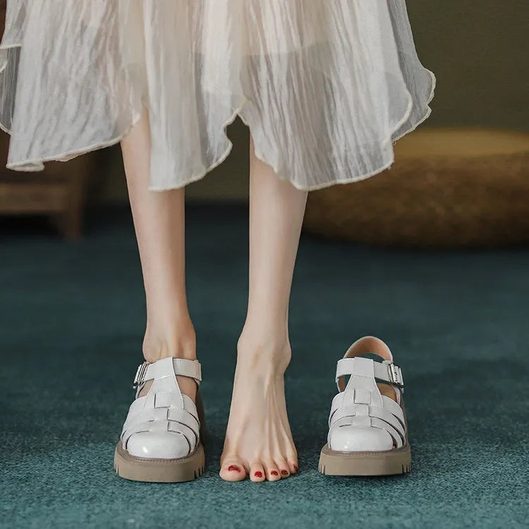 Women's beige retro platform sandals with chunky rubber sole and buckle closure.