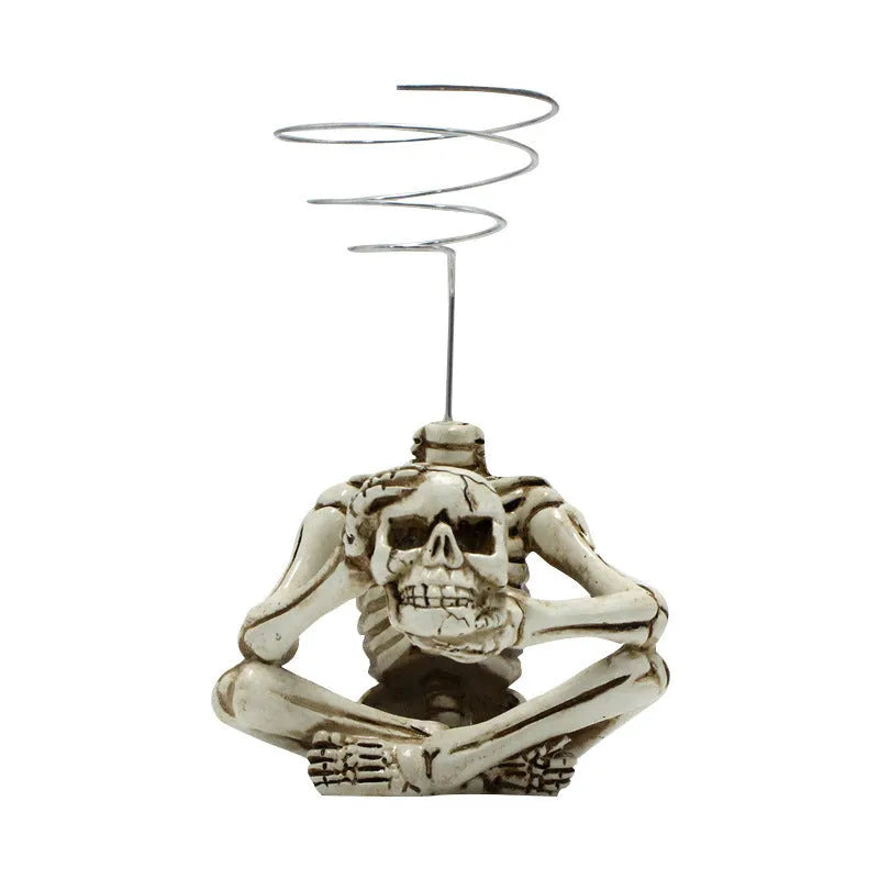 Resin tillandsia bracket with gothic skull design for soilless air plants, measuring 7cm wide by 8cm deep