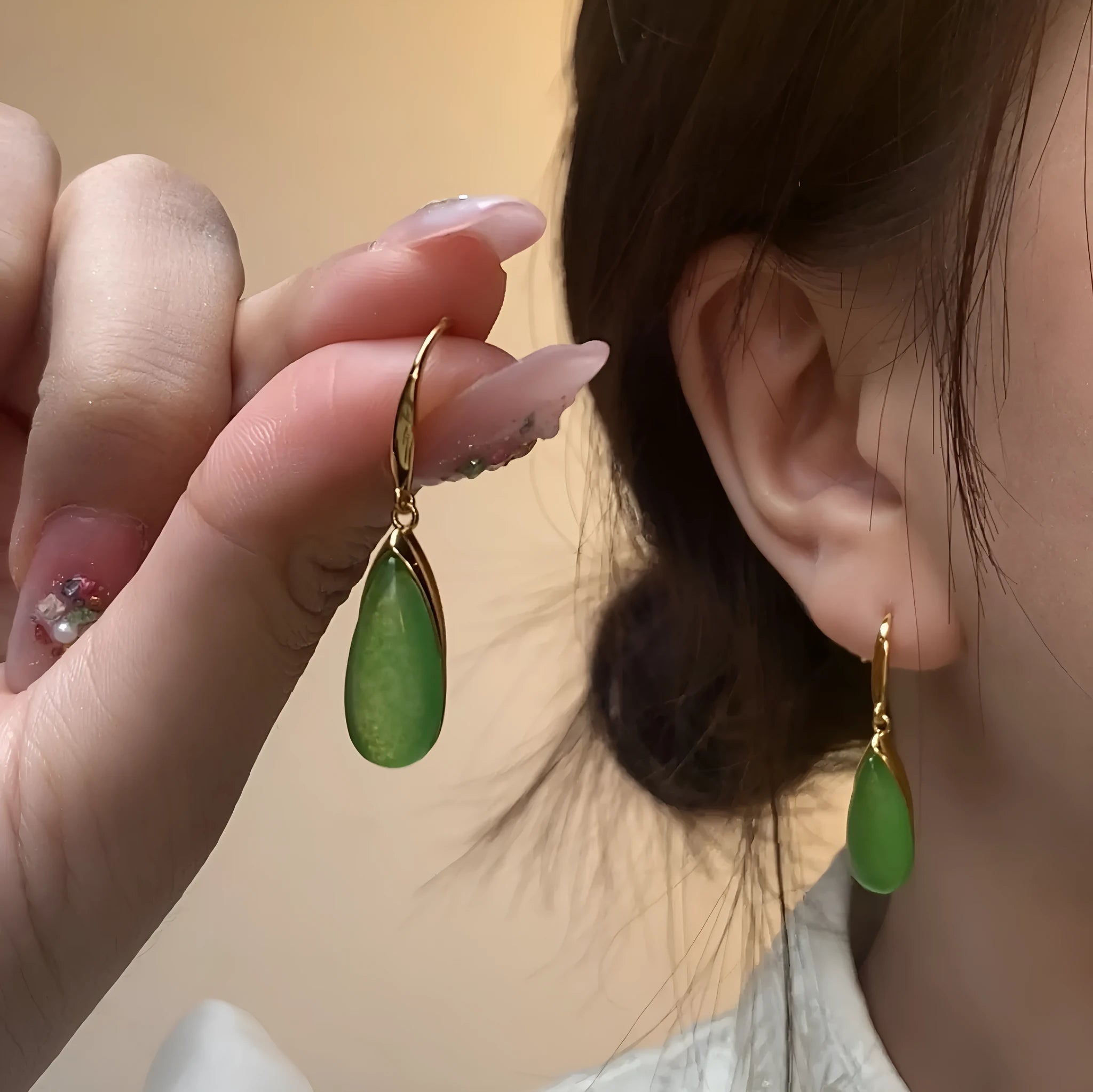 A pair of geometric copper earrings with a water droplet design and jade CP798 colour, Chinese style.
