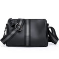 Black genuine leather crossbody bag showing adjustable strap and main compartment