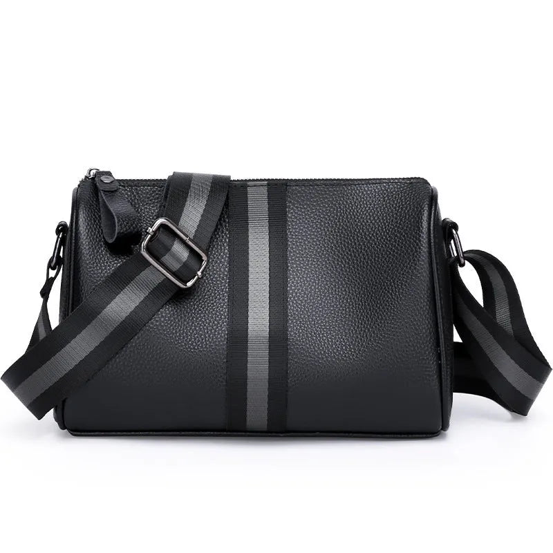 Black genuine leather crossbody bag showing adjustable strap and main compartment