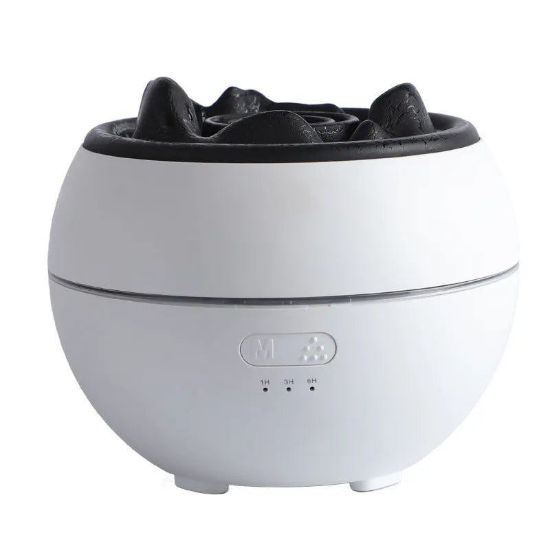 White round flame aroma diffuser humidifier with timer settings on a desk.