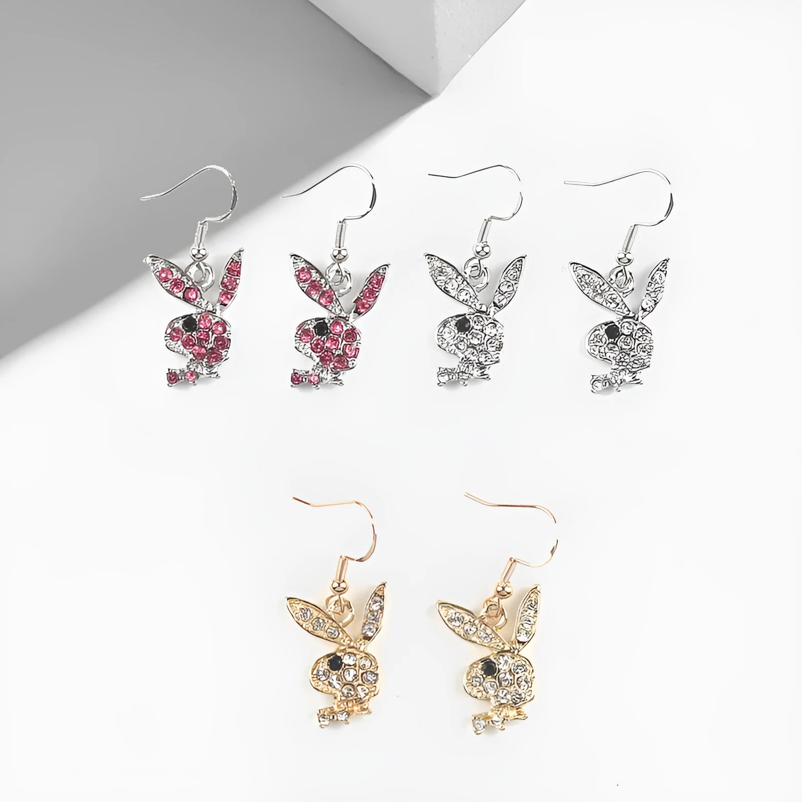 Cute full diamond rabbit stud earrings in silver, gold, and pink colour options.