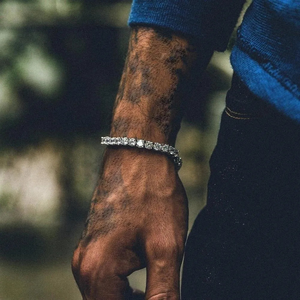 Men's silver hip hop bracelet with single row of rhinestones and geometric chain design