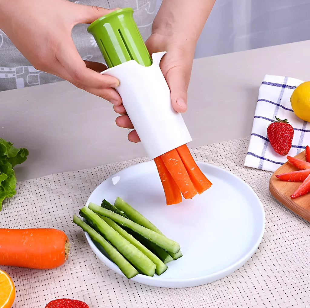 White vegetable cutter with six stainless steel blades for slicing cucumbers, carrots and strawberries