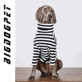 Large dog wearing thin black and white polyester inner clothing