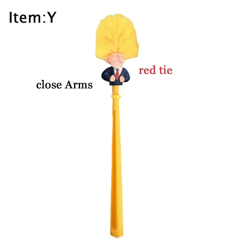 Yellow plastic Donald Trump toilet brush with hanging slot on handle.
