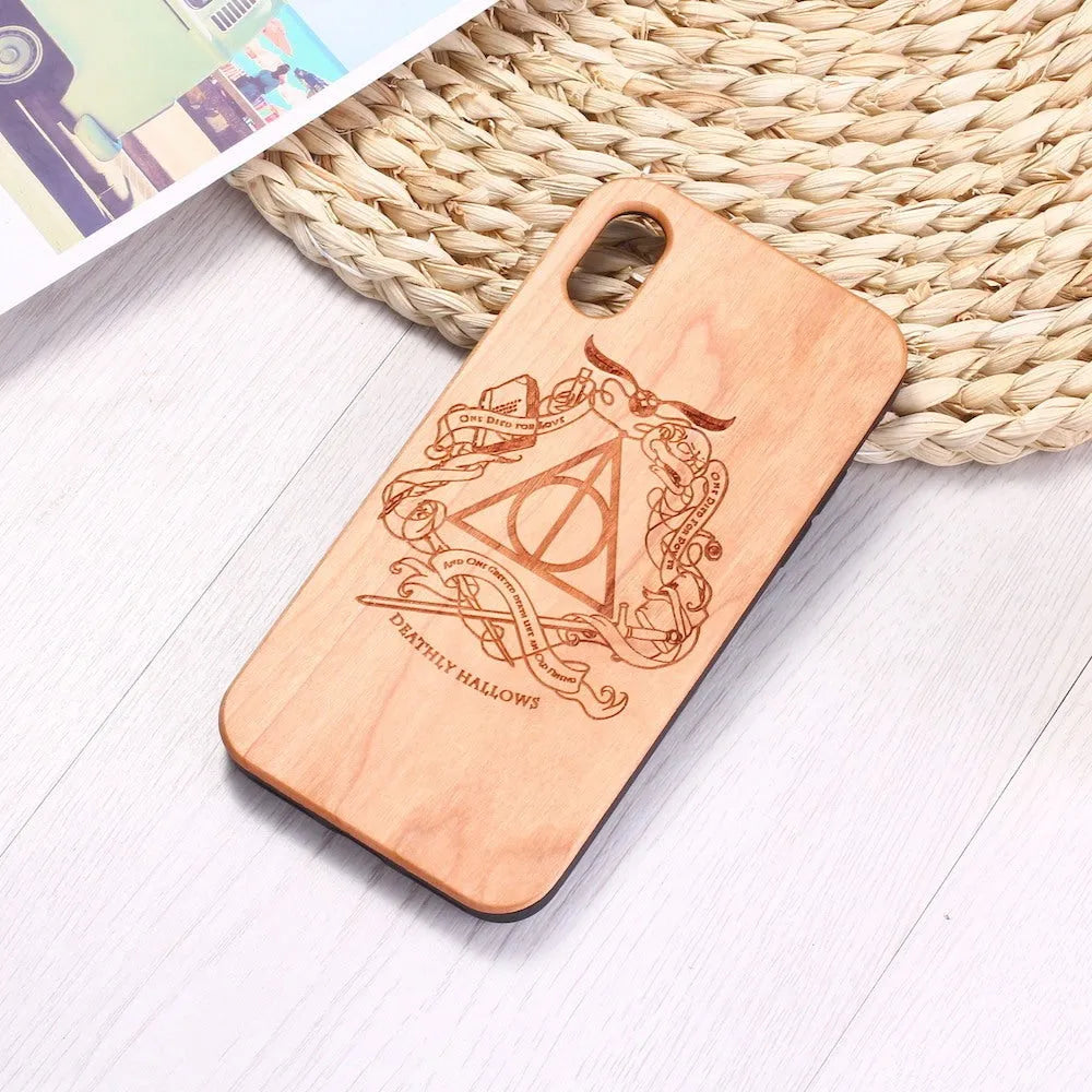 Wooden phone case with TPU frame showing laser-carved wood back and protective edges