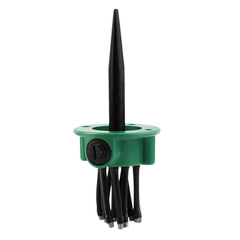 Green plastic adjustable lawn sprinkler with multiple bendable spray arms on a 9cm base.