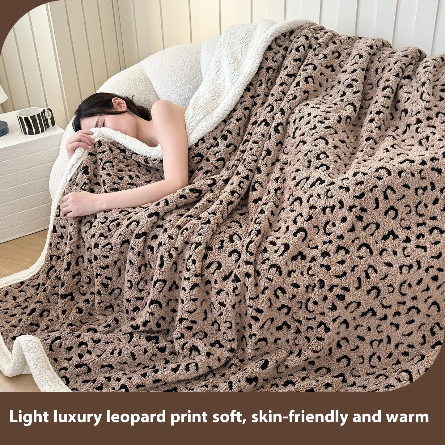 Double-layer taffeta blanket with woven leopard print pattern draped over sofa