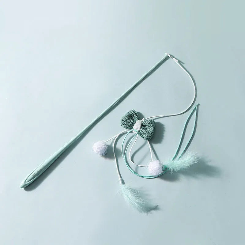 Adjustable cat teaser wand with telescopic pole extended to show feather attachments and inflatable ego component