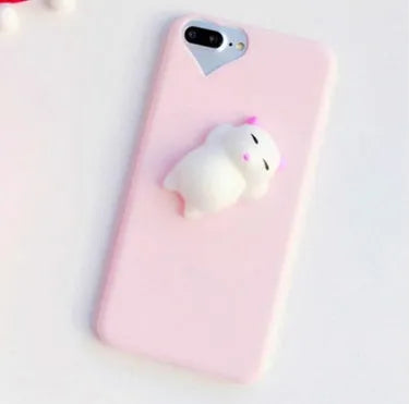 Soft pink silicone iPhone case with a 3D cartoon cat design on the back.