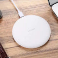 Qi certified 10W wireless charger pad in black rubber oil shell with Micro USB port and indicator light