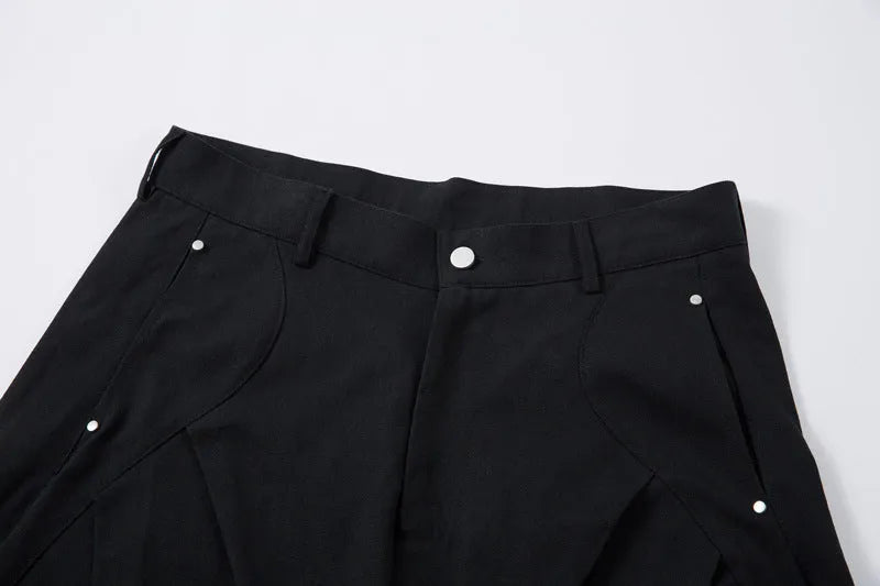Black men's pleated casual trousers with a loose wide-leg fit on a hanger