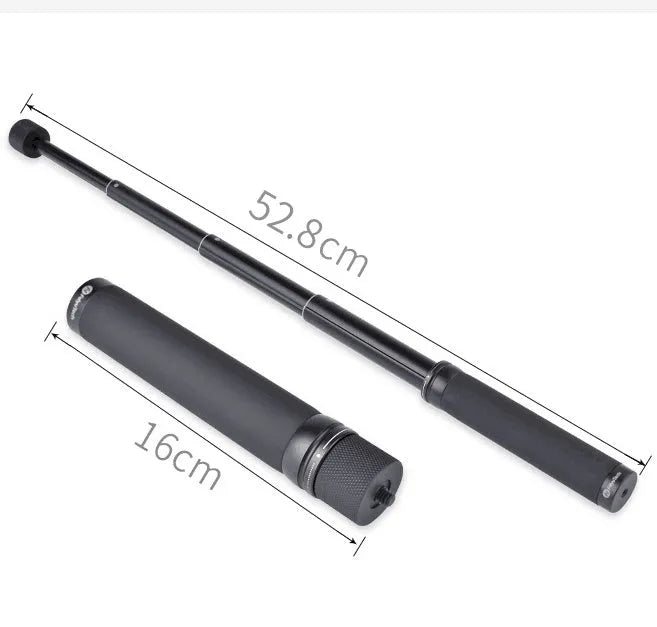 Black retractable aluminium selfie stick extended with phone attached, showing Bluetooth remote and tripod stand.
