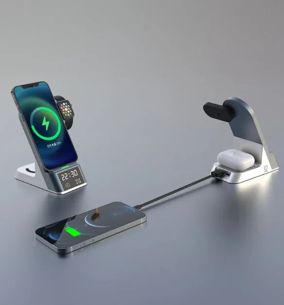 Black multifunctional alarm clock with wireless charging pad, Apple Watch dock, and USB-A port on bedside table.