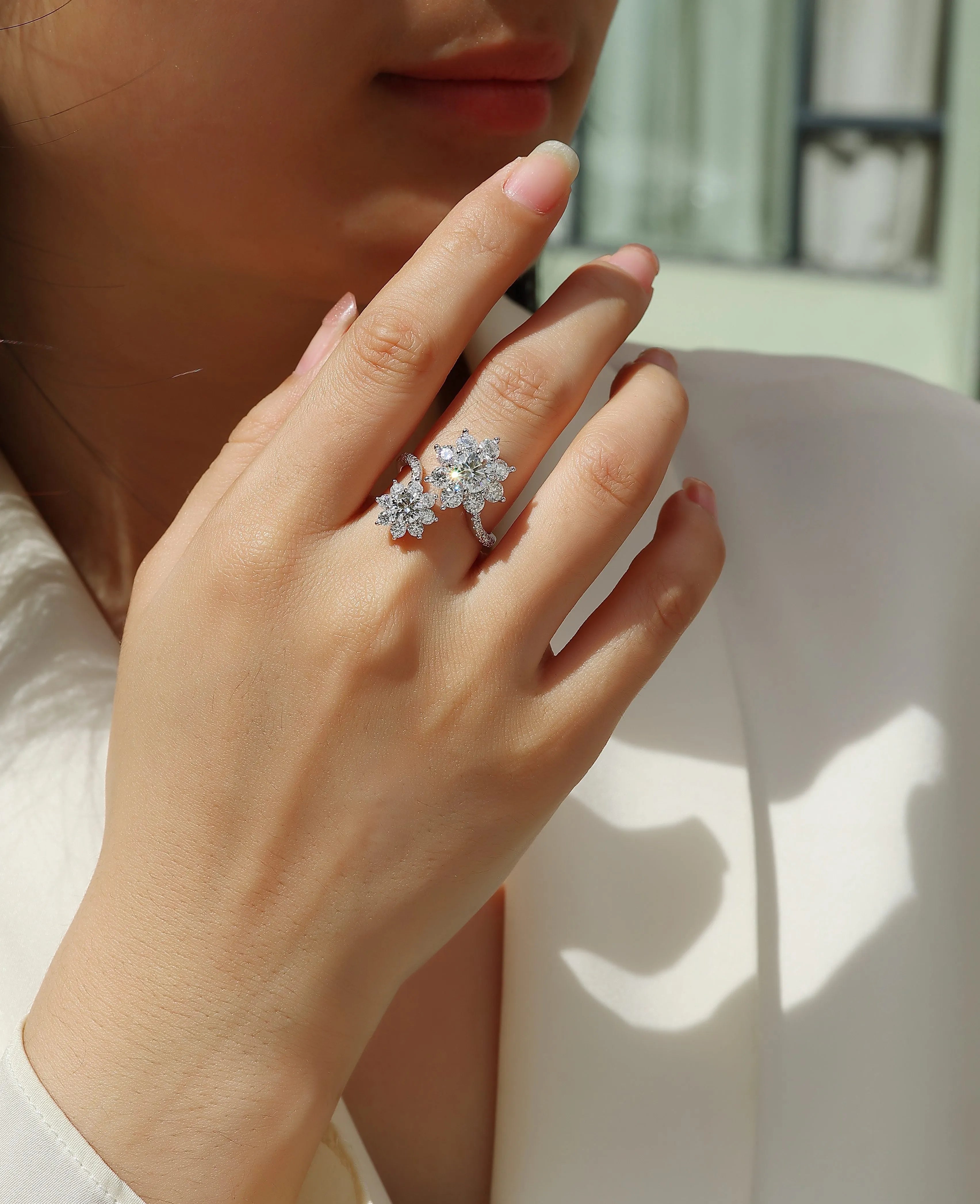 Wedding ring set with 1 carat round moissanite stone in S925 silver with platinum plating on white background