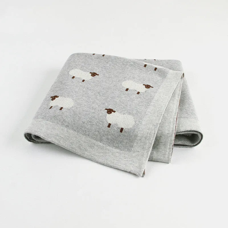 Soft pink baby blanket cover for a sheepskin, laid flat showing its rectangular 100cm by 80cm size.
