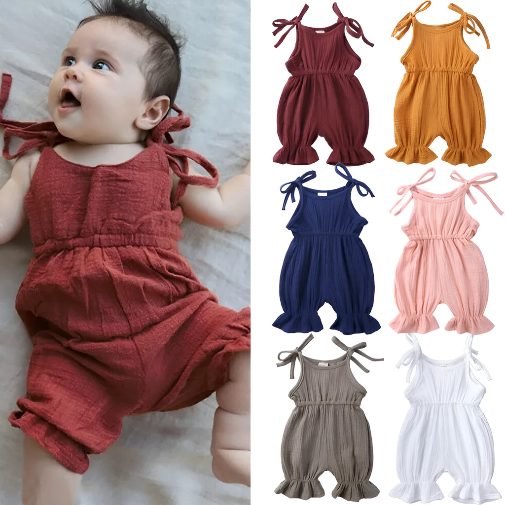 Baby girls sleeveless solid cotton romper jumpsuit in pink, front view