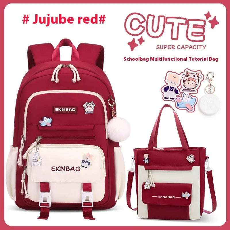 Girls' pink waterproof Oxford cloth school backpack with curved shoulder straps.
