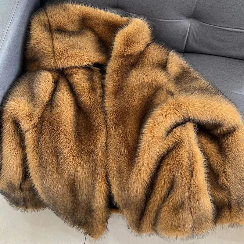 Women's loose mid-length artificial fur coat in silver grey colour showing regular sleeves and midi cut