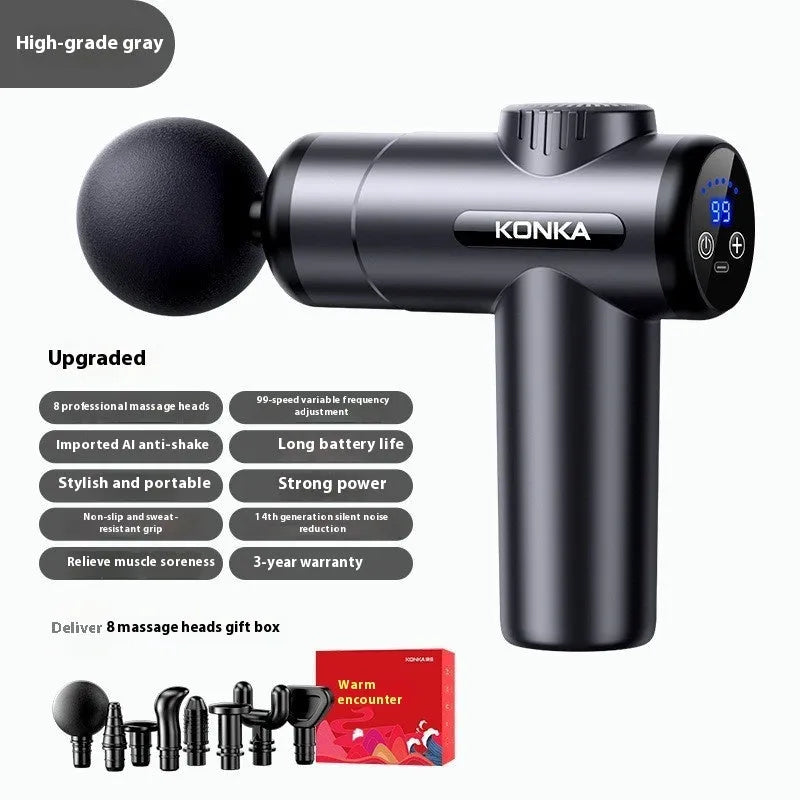 Konka professional electric mini massage gun in grey with multiple massage heads on a table