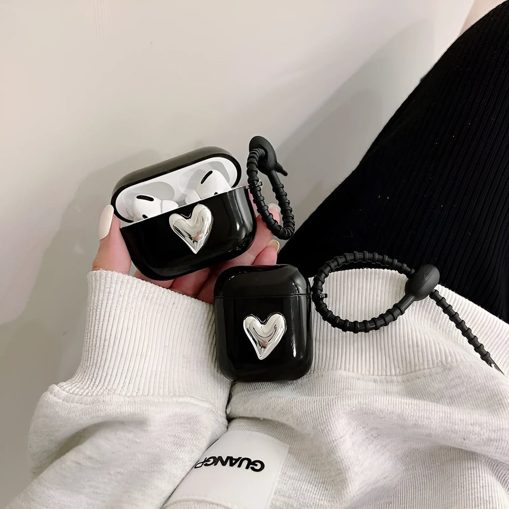 Black earphone sleeve with electroplated love heart design for AirPods case showing TPU back cover and black cord