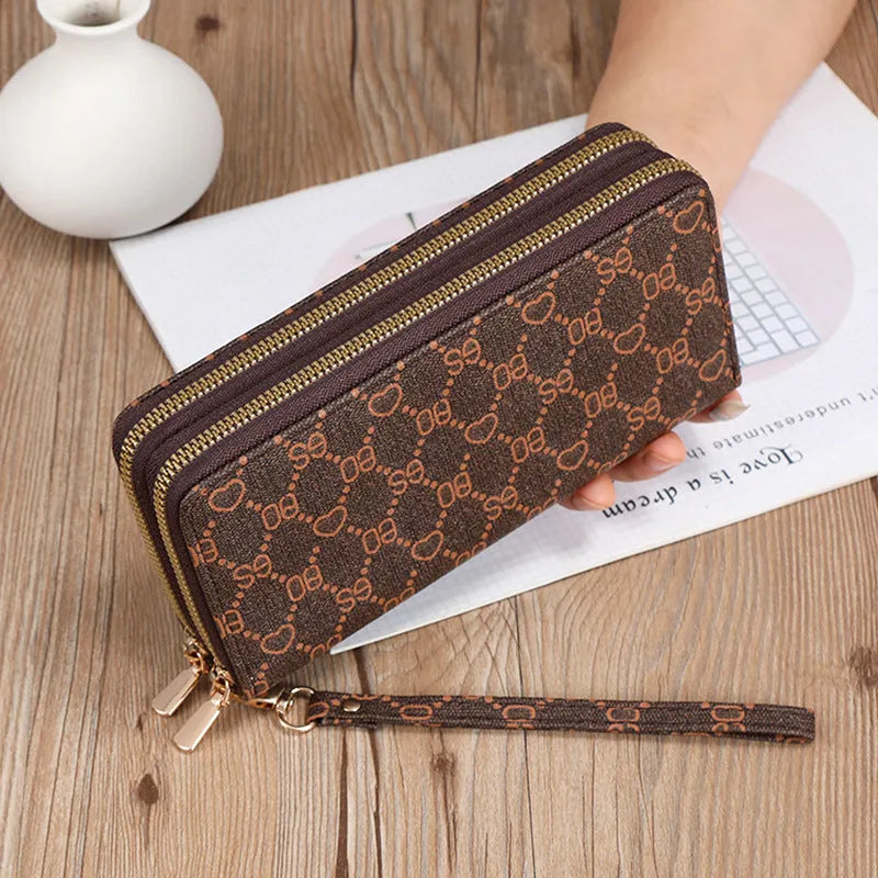 Long black PU leather wallet clutch with retro styling, open to show mobile phone compartment and coin purse sections
