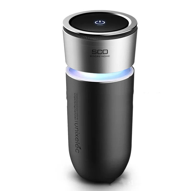 USB negative ion car air purifier in grey, compact 75x75x165mm size on a desk